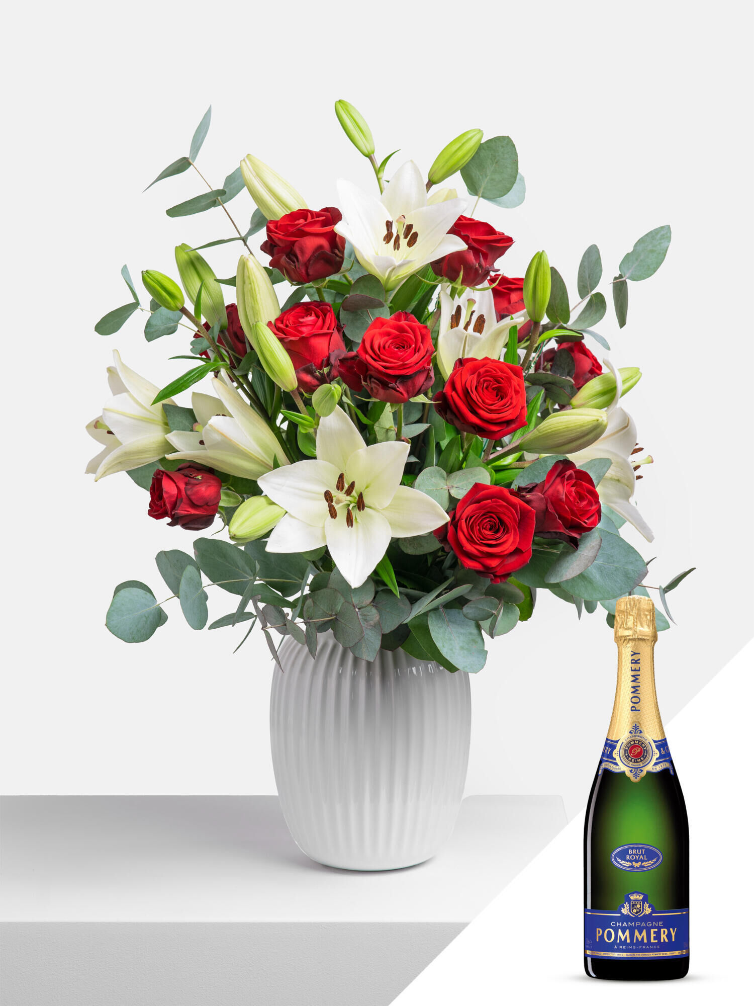 Für erlesene Momente mit Champagner - Hauptblüte: Lilien, Rosen - Hauptfarbe: Rot, Weiß