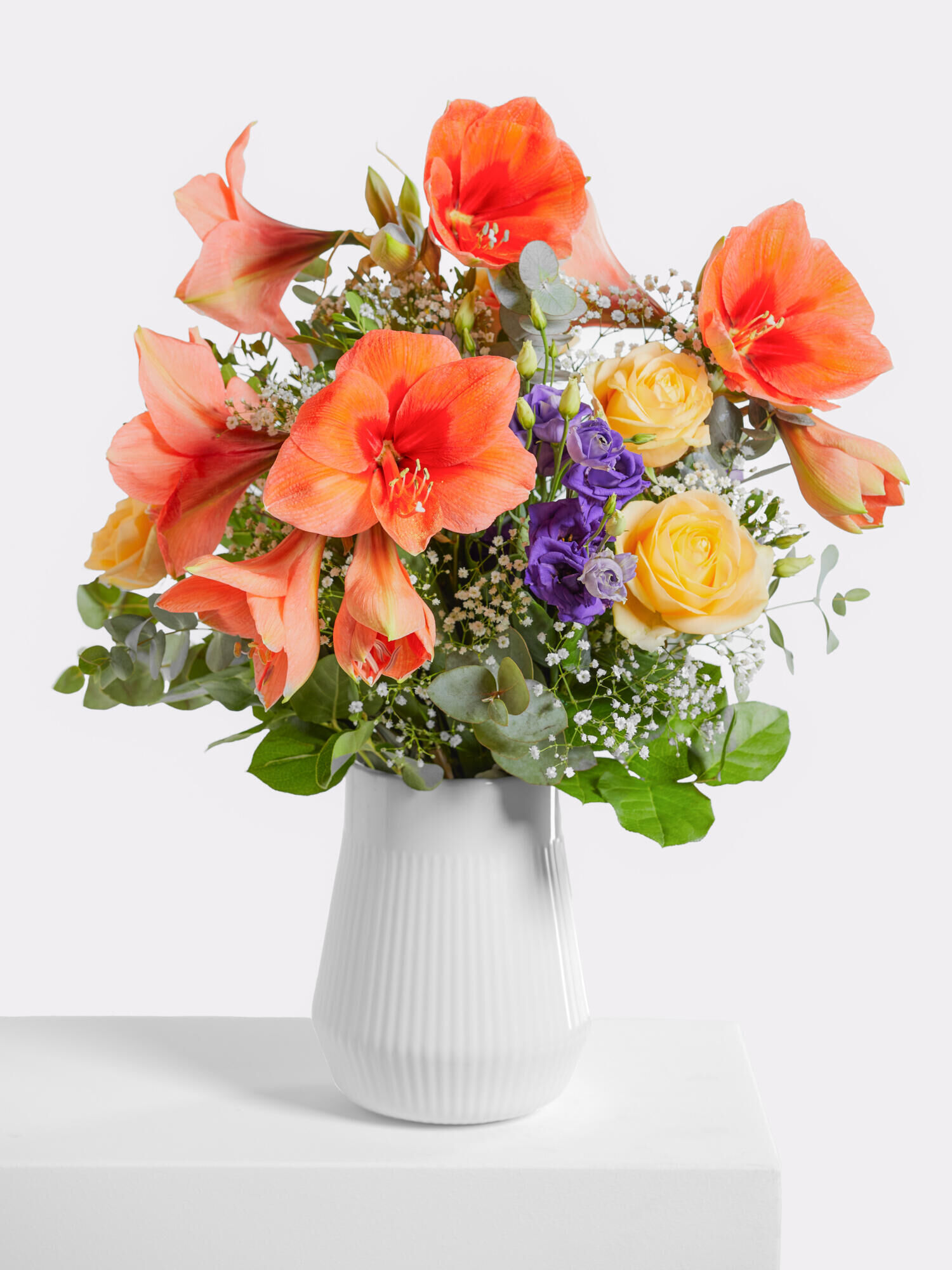 Besinnlichkeit - Hauptblüte: Amaryllis, Eustoma, Rosen - Hauptfarbe: Apricot, Violett