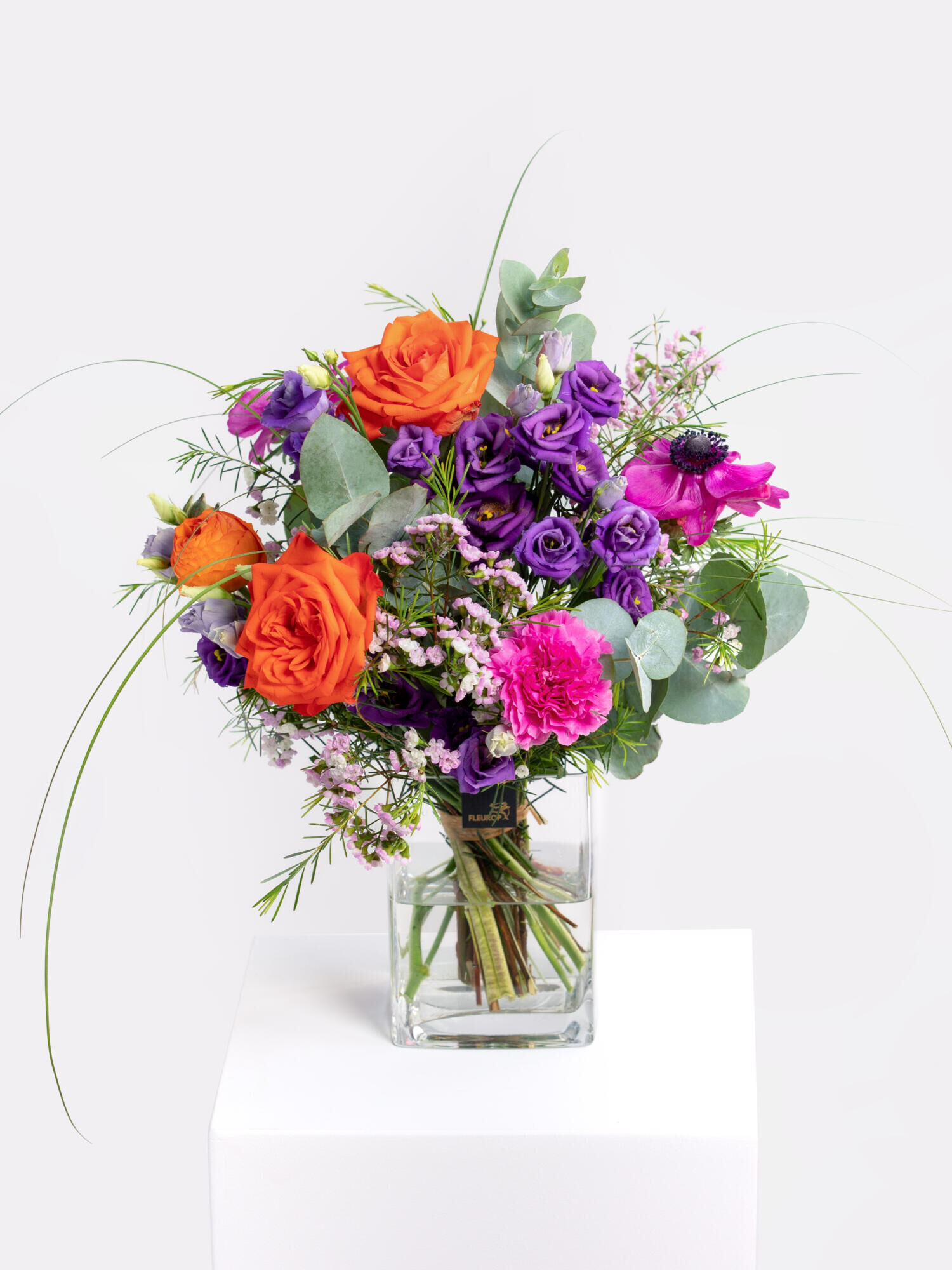 Freudige Umarmung - Hauptblüte: Eustoma, Nelken, Ranunkeln, Rosen - Hauptfarbe: Orange, Pink, Violett