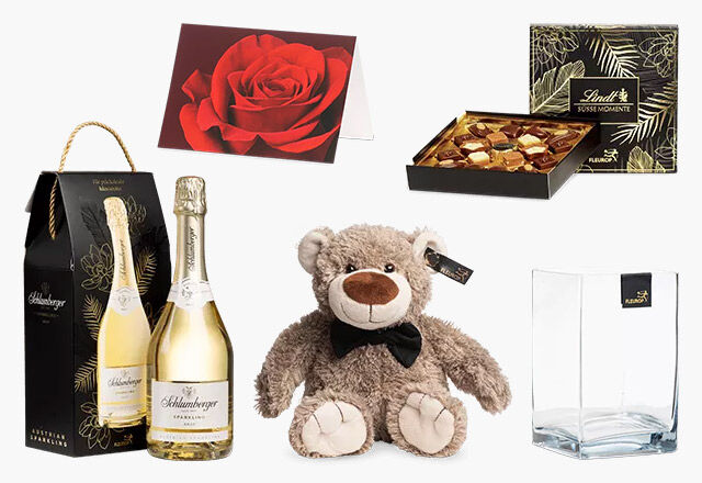 Schlumberger Sekt, Teddy, Fleurop Vase, Lindt-Schokolade, Grußkarte mit roter Rose als Motiv