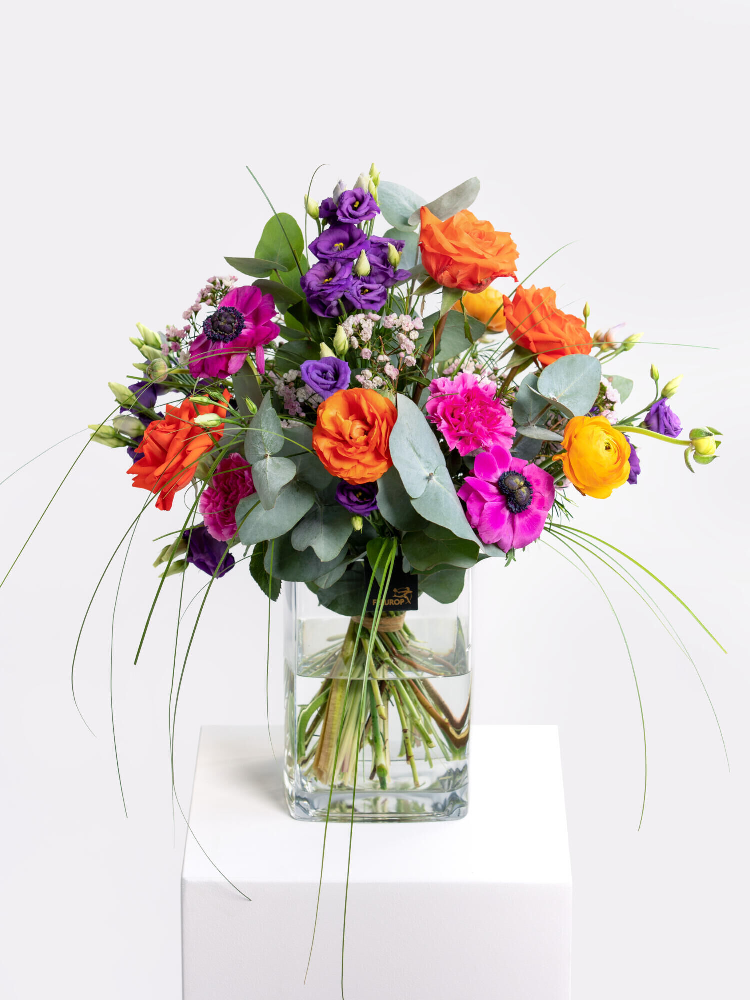 Freudige Umarmung - Hauptblüte: Eustoma, Nelken, Ranunkeln, Rosen - Hauptfarbe: Orange, Pink, Violett