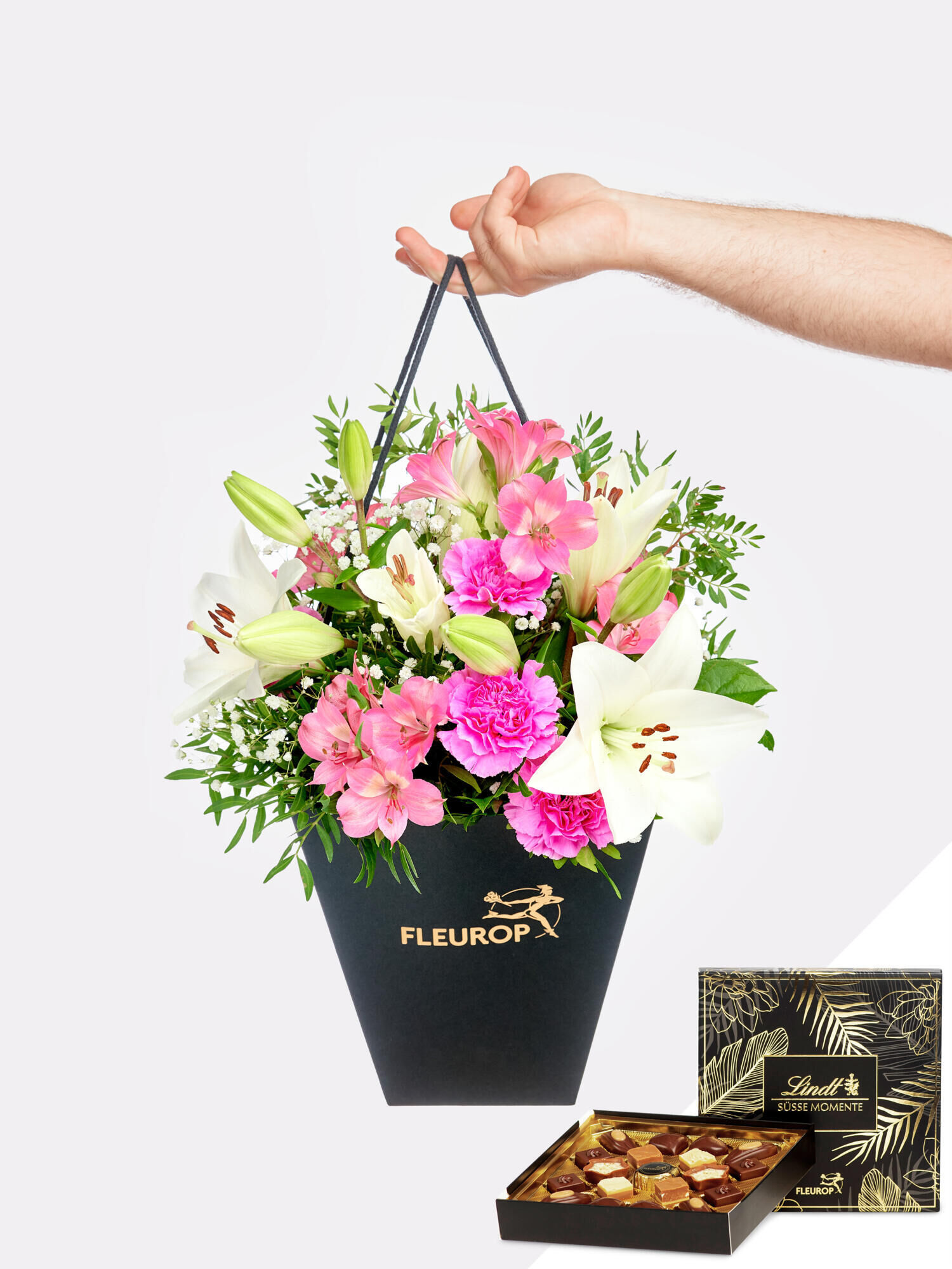 Fröhlich und aufgeweckt mit Lindt-Pralinen - Hauptblüte: Alstromerien, Lilien, Nelken - Hauptfarbe: Pink, Rosa, Weiß