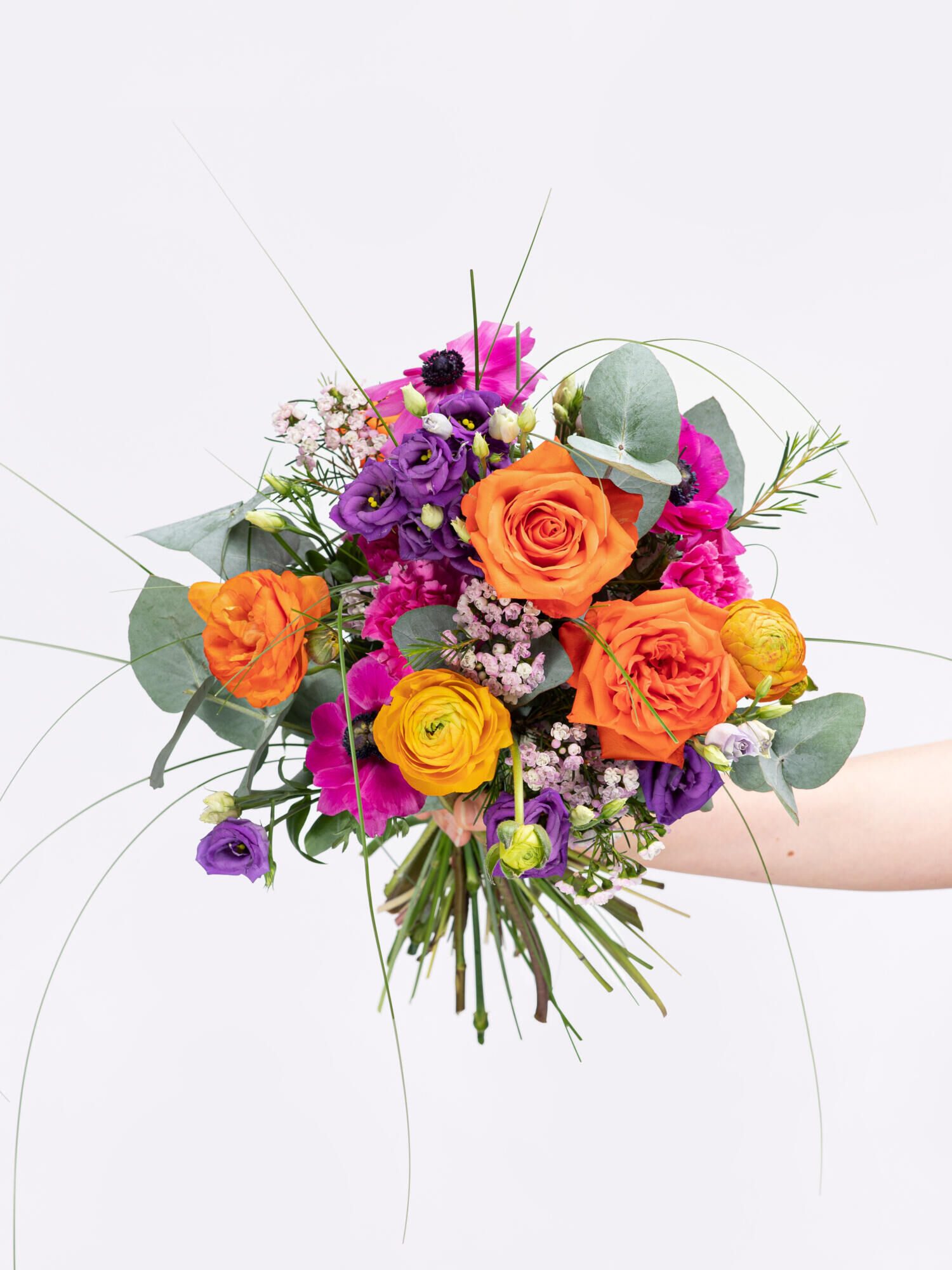 Freudige Umarmung - Hauptblüte: Eustoma, Nelken, Ranunkeln, Rosen - Hauptfarbe: Orange, Pink, Violett