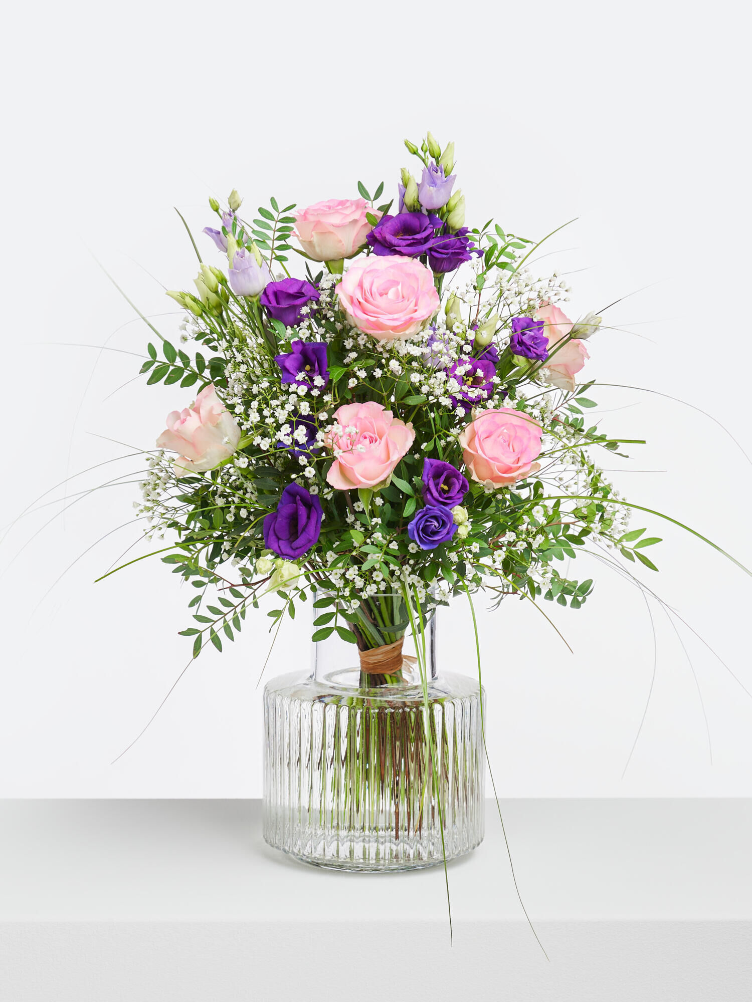 Strauß der Woche - Hauptblüte: Eustoma, Rosen - Hauptfarbe: Rosa, Violett