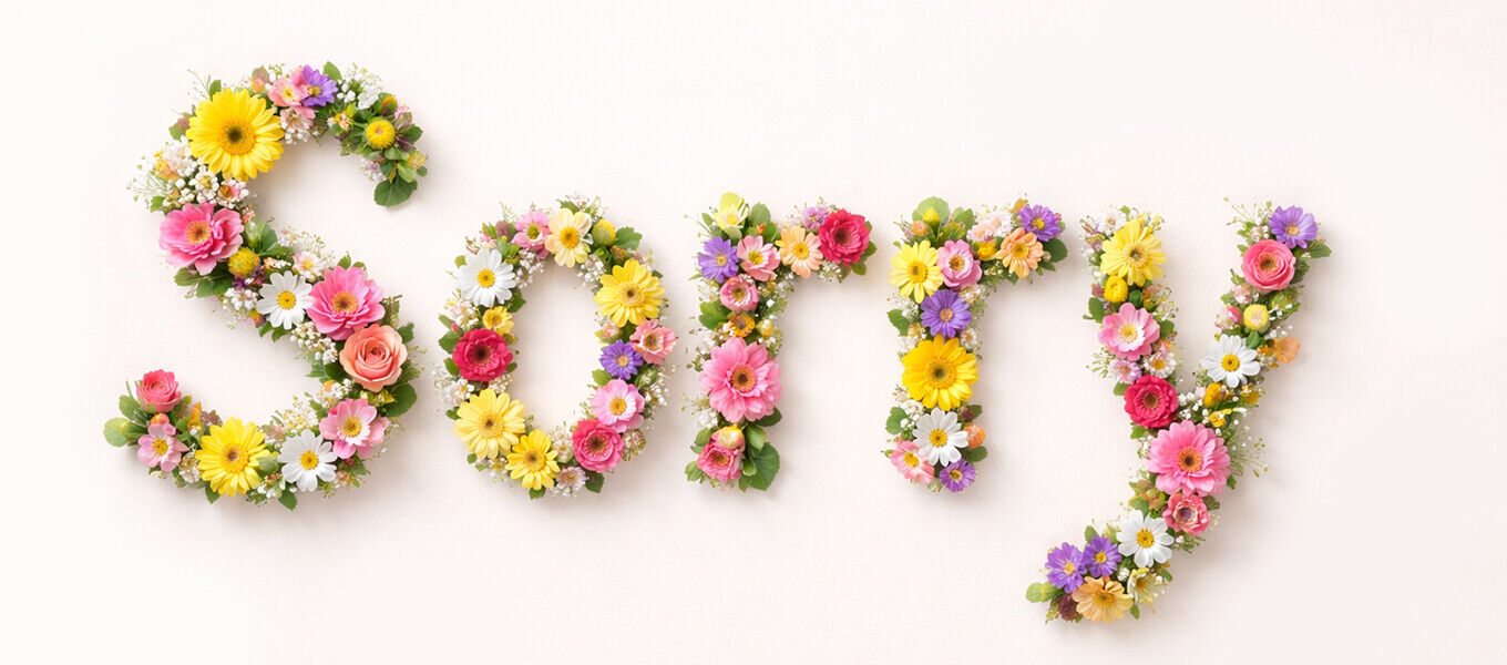 Bunter Blumen Schriftzug Sorry als Inspiration für eine Entschuldigung schreiben